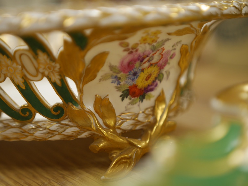 A mid 19th century English porcelain basket and a similar dish, 32cm. Condition - area of restoration to basket